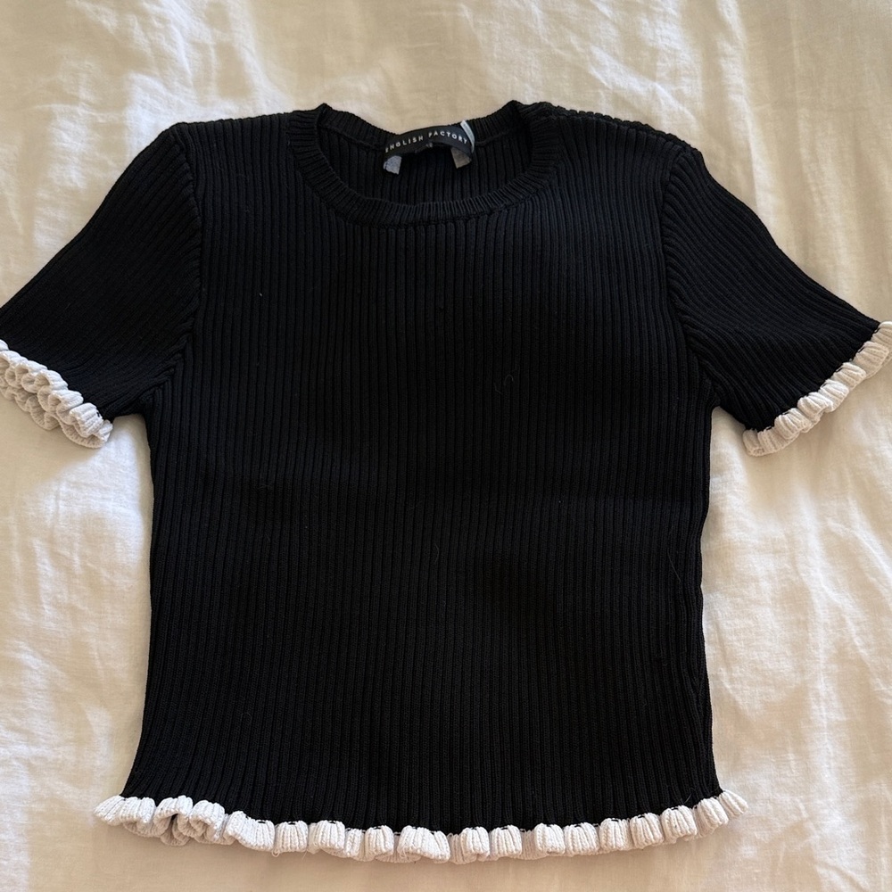 English Factory black ribbed top with white ruffle accents